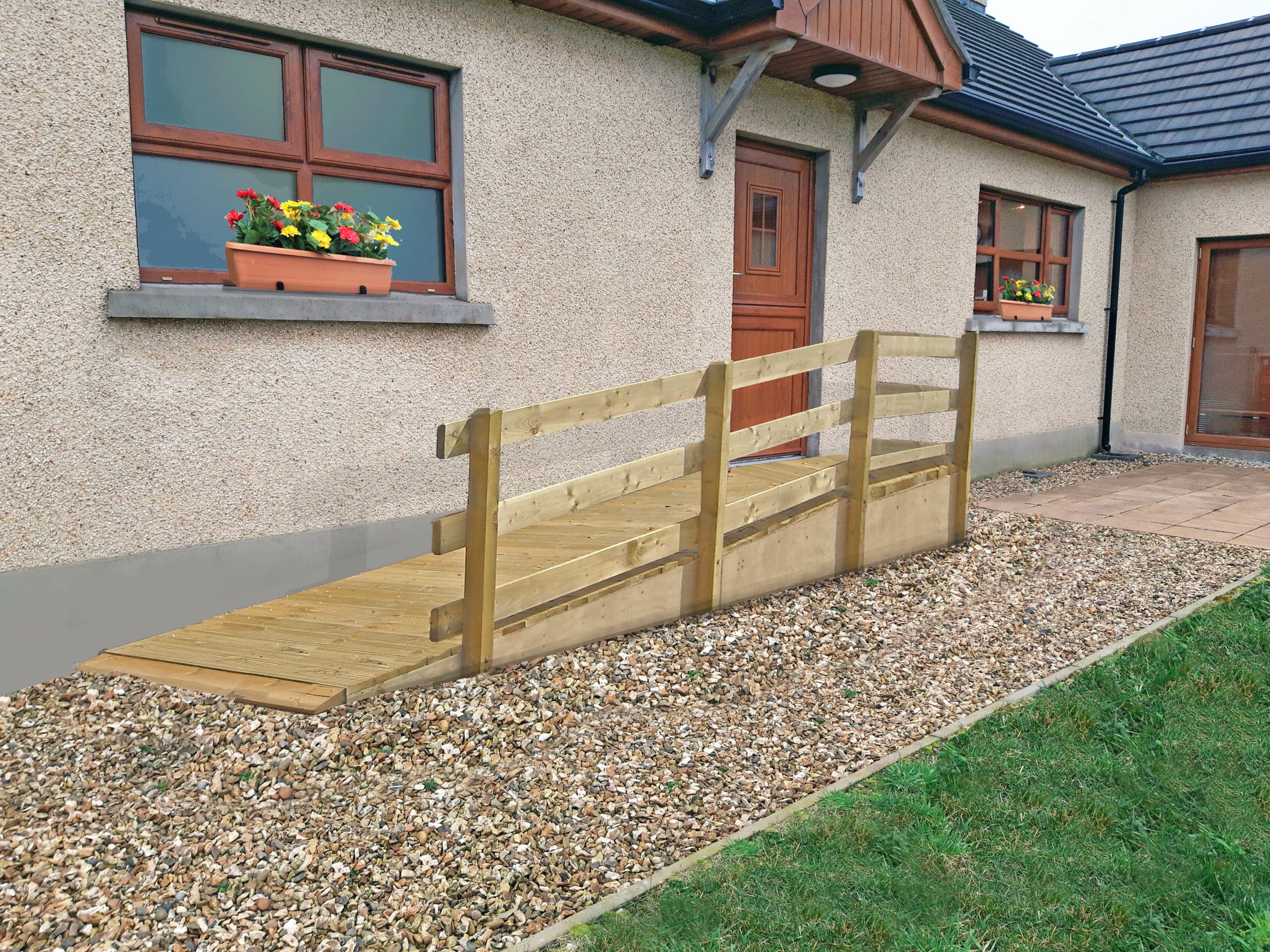 Wheelchair ramp over a step into house Wheelchair ramp over a step into house