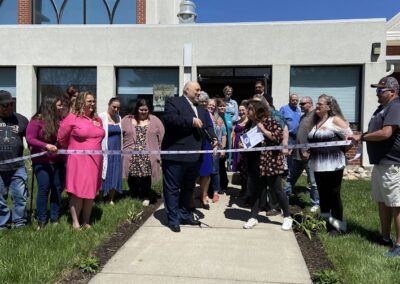 LIFTT Executive Director Carlos Ramalho does the honros as other team members look on during the Billings Chamber of Commerce Ribbon Cutting at the LIFTT Grand Opening on May 10, 2024