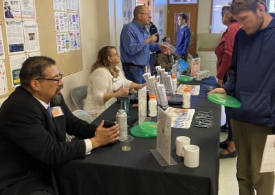 LIFTT Team Members Al Black Crow, Tara Robison, and John Robison engage with the public during the LIFTT Grand Opening on May 10, 2024.