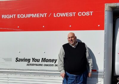 LIFTT Executive Director Carlos Ramalho stand in front of a U-Haul truck as the moving process is underway