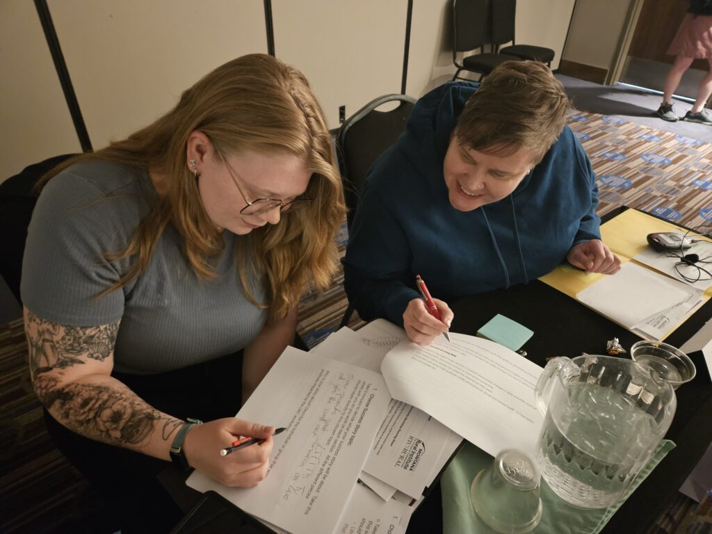 LIFTT IL Specialist Rachial Combs (left) and Peer Program Coordinator Tanya Thomas (right) working on a project during the recent Living Well in Community Rendezvous at Fairmont Hot Springs