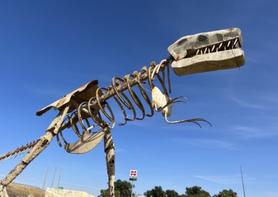 Metal skeletal sculpture of Tyrannous Rex by Neil Young