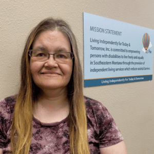 LIFTT IL & CFC program manager Freda Mook, A White woman with brown hair streaked blond wearing glasses and a tie die shirt in shades of purple