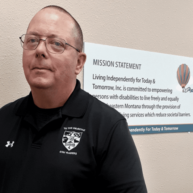 LIFTT Outreach Coordinator and Community Health Work Supervisor John Robison; White male with very short hair wearing glasses and a black polo shirt