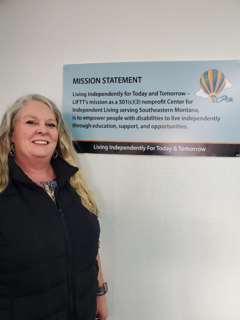 white female with blond hair wearing a black jacket